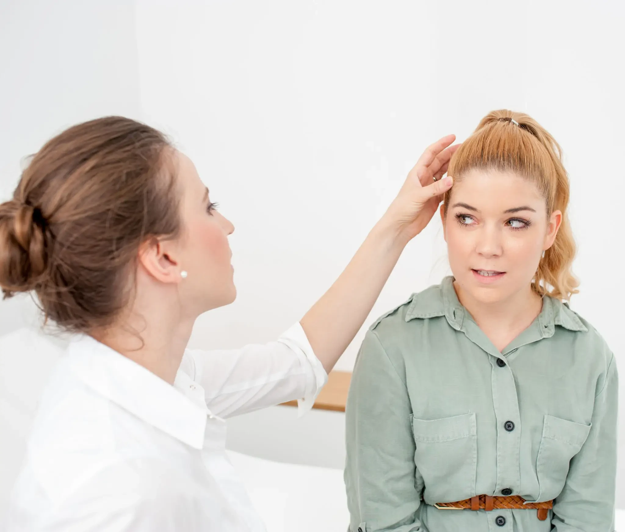 Woman receiving a wig fitting consultation at Foxy Hair Alternatives